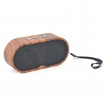 Kleine draagbare Bluetooth-luidspreker in donker hout. Kleine draagbare Bluetooth-luidspreker in donker hout.