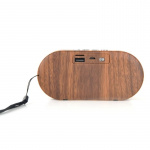 Kleine draagbare Bluetooth-luidspreker in donker hout. Kleine draagbare Bluetooth-luidspreker in donker hout.